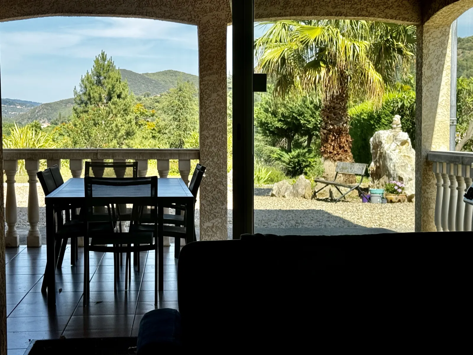 Covered dining terrace with a view